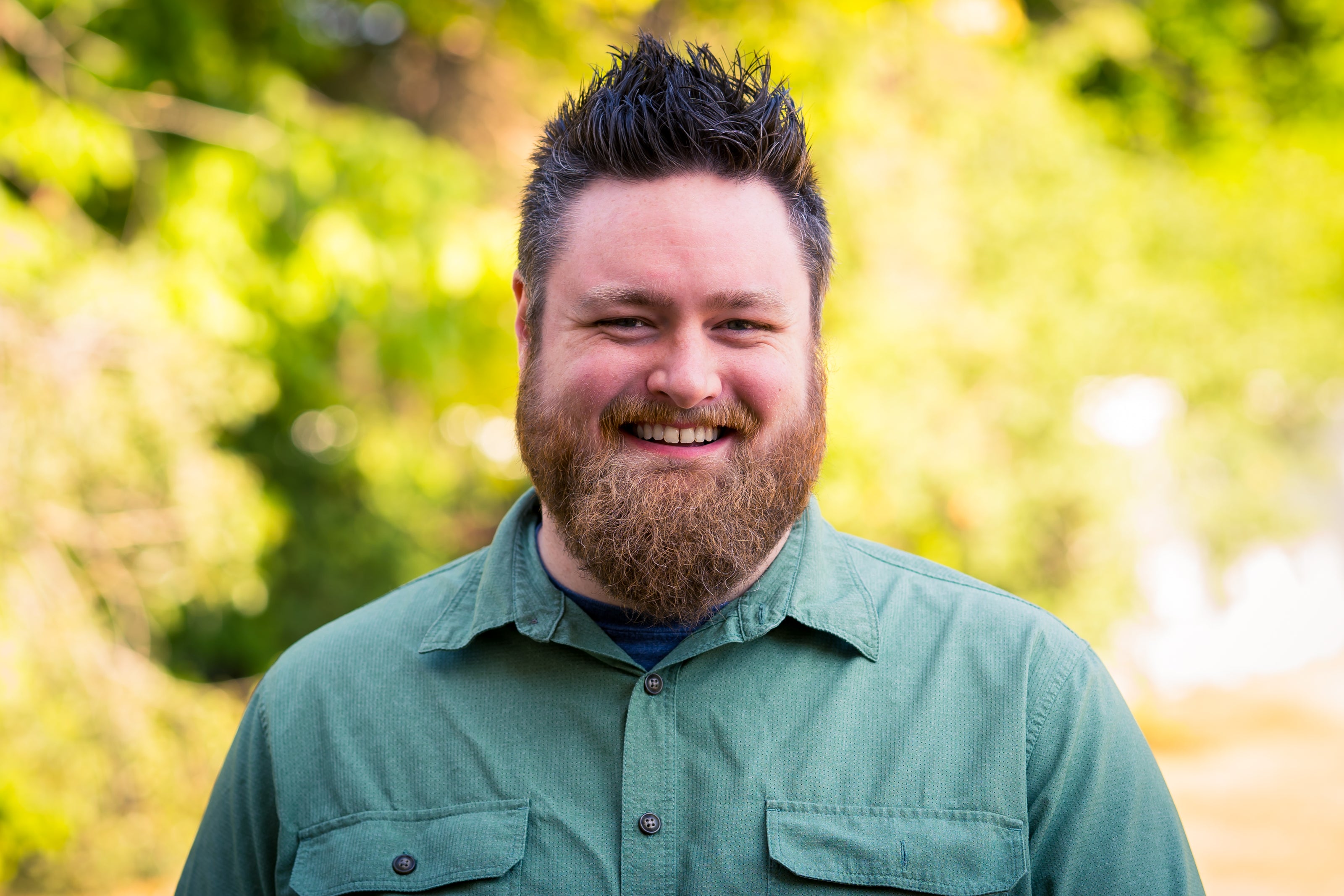 man in green shirt portrait