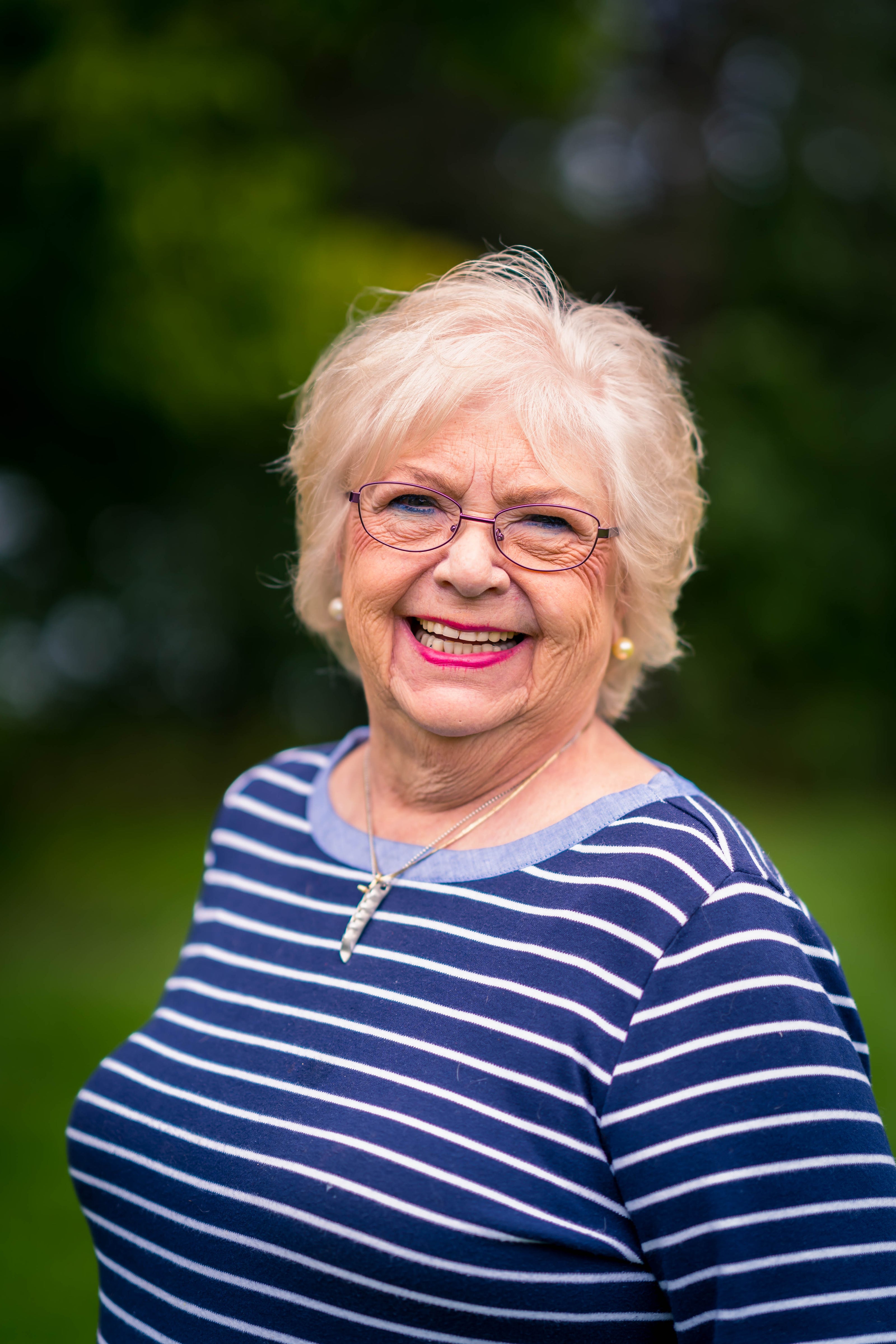 woman with blue shirt and white stripes church directory portrait